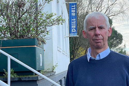 John Milne outside the Drill Hall