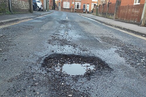 Photo: Pothole on Trinity Road, Hurstpierpoint which was the recent subject of an ITV News report on poor road maintenance in West Sussex